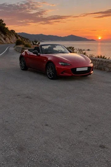 Red convertible, coast road